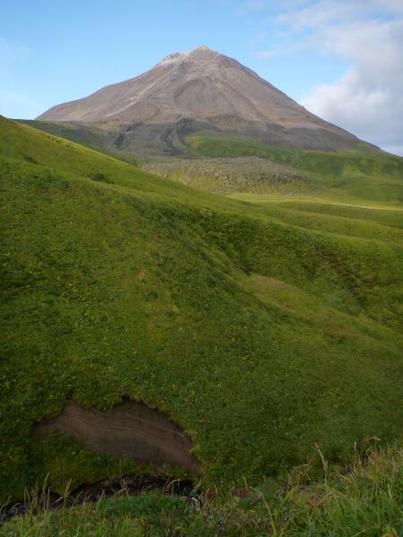 Kanaga Volcano, seen from the east, with blocky 1906 lava flow. Western Aleutian field work, September 2015. Tephra section in foreground. 