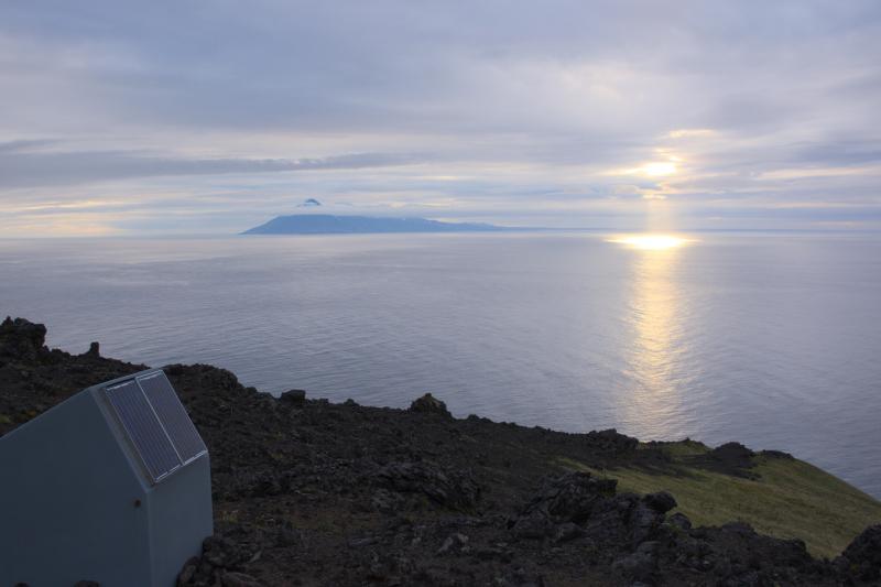 Gareloi Volcano seismic station GAEA with Tanaga Island in the background. 2015 Western Aleutians AVO-USGS, NSF Geoprisms and Deep Carbon Observatory collaboration.
