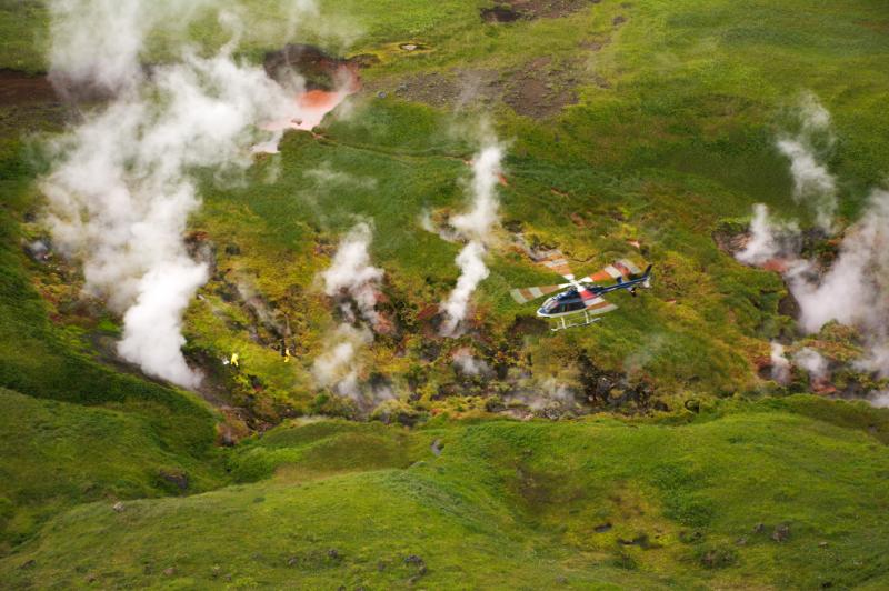 Helicopter pilot Dan Leary prepares to pick up geochemists Cindy Werner and Christoph Kern at the upper Geyser Bight geothermal area, Umnak Island. 2015 Western Aleutians AVO-USGS, NSF Geoprisms and Deep Carbon Observatory collaboration.
Free downloadable publication on Geyser Bight: http://www.dggs.alaska.gov/pubs/id/2480 