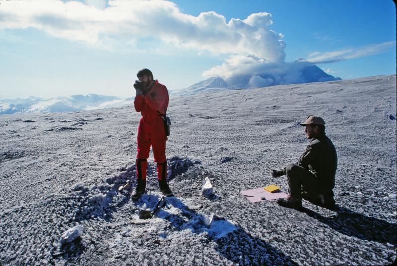 Willie Scott (CVO) and Game McGimsey (AVO) collecting a measured-area tephra sample from the April 21, 1990 eruption of Redoubt Volcano; see image 379 for a view of the eruption cloud.