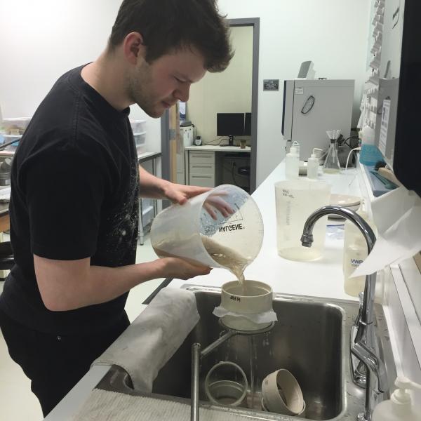 AVO staff Mark Hansen processing samples of the March 28, 2016 Pavlof ash from Nelson Lagoon.