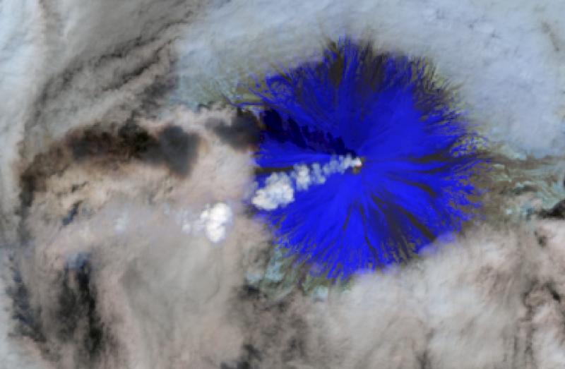 Landsat-8 data from 15 May 2015 at 22:17 UTC (2:17 PM AKDT) show robust steaming and high temperatures in Cleveland Volcano&#039;s summit crater (in the shortwave IR), indicating continued unrest. The high-temperature feature is visible in this image as a red pixel. Robust steaming observed extending to the west and seen as a shadow on the lower meterological cloud deck. Shortwave IR has very little reflectance from snow, which is why Cleveland appears blue. 