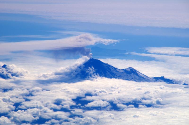 View of Pavlof Volcano on 7/28/2016 at 13:00 Alaska time showing an ash and steam cloud drifting to the northeast. This photo was taken en route from Dutch Harbor to Anchorage from aboard PenAir aircraft.