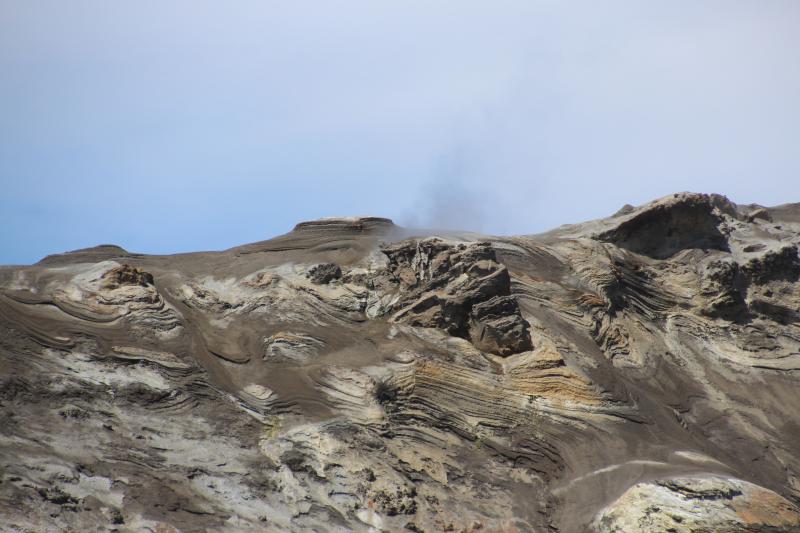Example of hard-packed surface and steep degassing sites common on the Crater Rim of Okmok&#039;s Cone C.