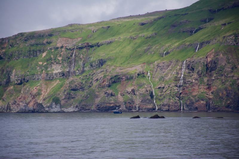 The Maritime Maid anchored below waterfalls on the south side of Tana Volcano.