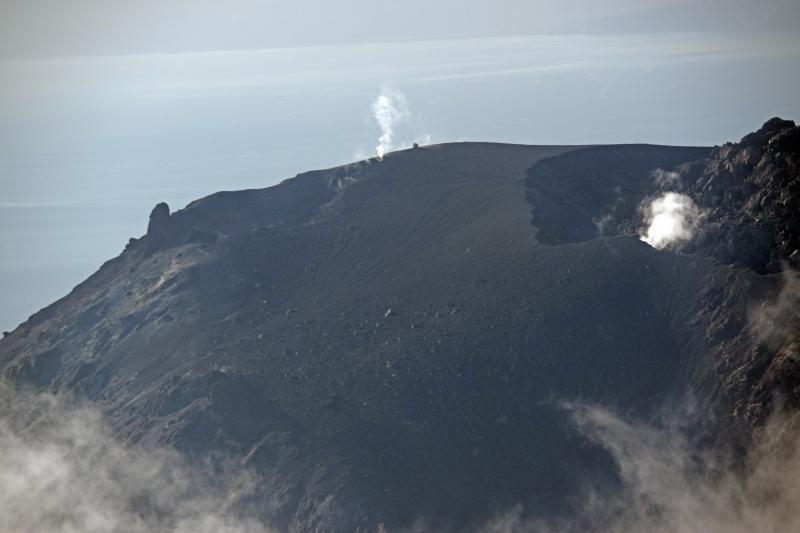 Aerial view of the south summit of Augustine Volcano.  Steam rises from a prominent fumarole on the 2006 lava dome, as well as through a crack in the tephra rampart behind (south of) the dome.  The small &quot;dot&quot; to the right of the far steam plume is the AVO real-time gas measuring station for detecting CO2 and SO2 gases. Photo taken September 29, 2016, by Game McGimsey, USGS/AVO.
#fieldphotoFriday #usgs #avo