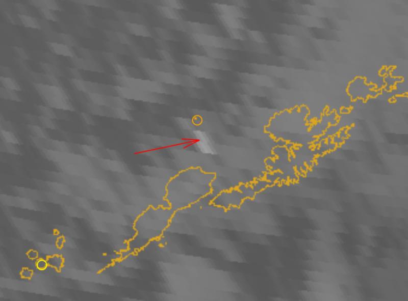Satellite image, with a red arrow pointing to the detached eruption cloud from Bogoslof, 4:15 pm December 20 AKST (01:15 am December 21 UTC). Bogoslof is the small dot circled in orange, in upper-center of the image. Yellow circle in lower-left surrounds Cleveland volcano. Thermal infra-red GOES satellite image.
