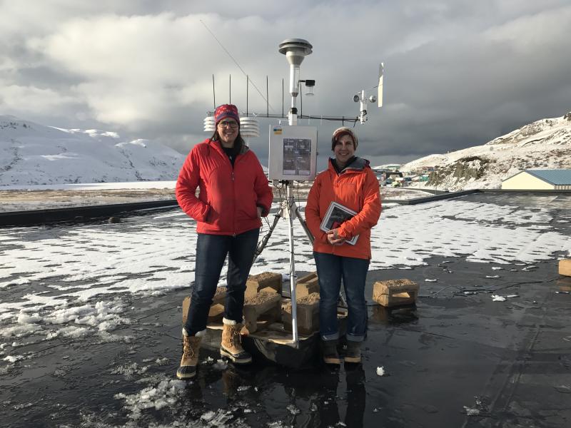 Janet Schaefer (DGGS/AVO) and Kristi Wallace (USGS/AVO) install an air quality monitor on the roof of the Unalaska Department of Public Works during the eruption of Bogoslof volcano.  The monitor is used to assess air quality during volcanic ash fall events.  During the course of their 5-day visit to the community of Unalaska/Dutch Harbor, Bogoslof erupted 4 times sending ash clouds 25,000 to 38,000 feet above sea level.
