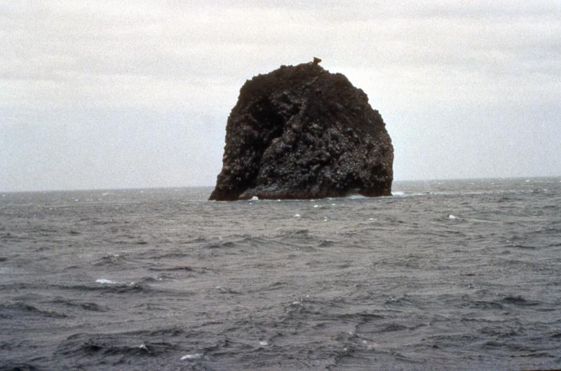 Fire Island, a remnant of a lava dome extruded during the 1883 eruption of Bogoslof volcano.  Fire Island and adjacent Bogoslof Island are the emergent summit of a submarine stratovolcano that rises 6000 feet from the floor of the Bering Sea.