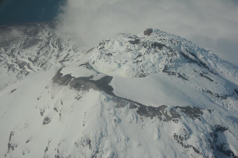 Aerial view of Augustine&#039;s snow-covered summit dome.