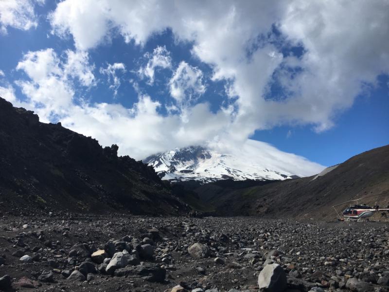 Looking up at the south flanks of Pavlof Volcano, July 19, 2017. At this time, Pavlof&#039;s steam plume was mixing with atmospheric clouds. Photo by Jessica Larsen, UAFGI/AVO. 