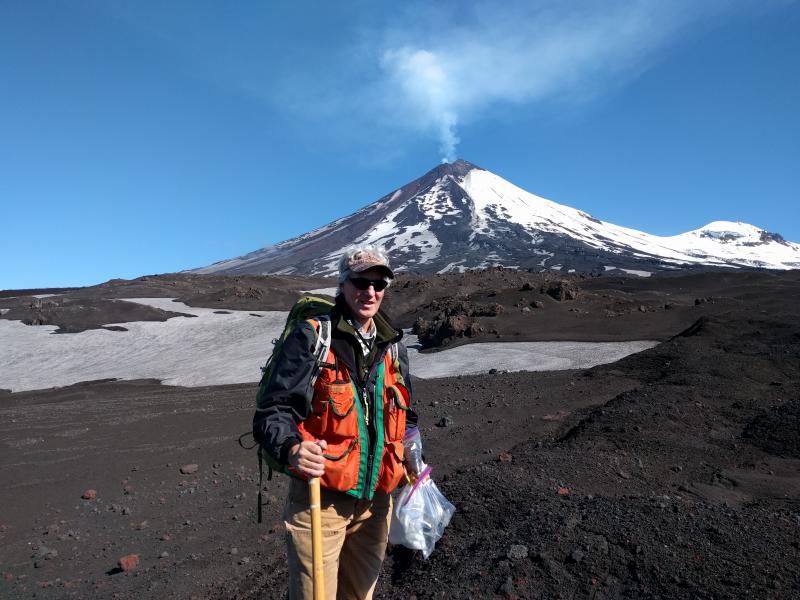 AVO geologist Chris Waythomas (USGS/AVO) collects samples at Pavlof Volcano during 2017 fieldwork. Photo by Pavel Izbekov, UAFGI/AVO.