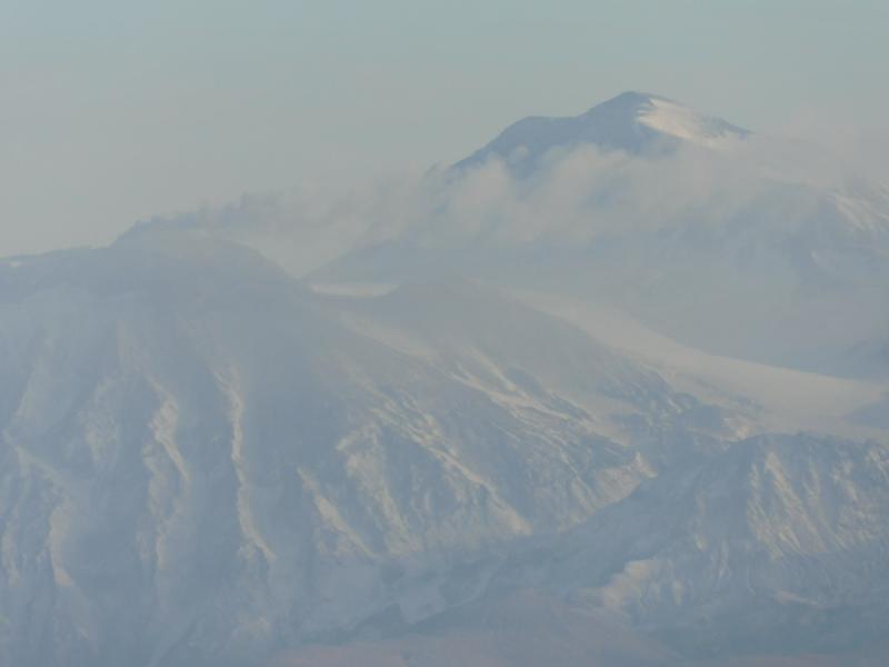 Steaming from Great Sitkin Volcano as visible from the town of Adak (40 km or 25 miles to the SW).