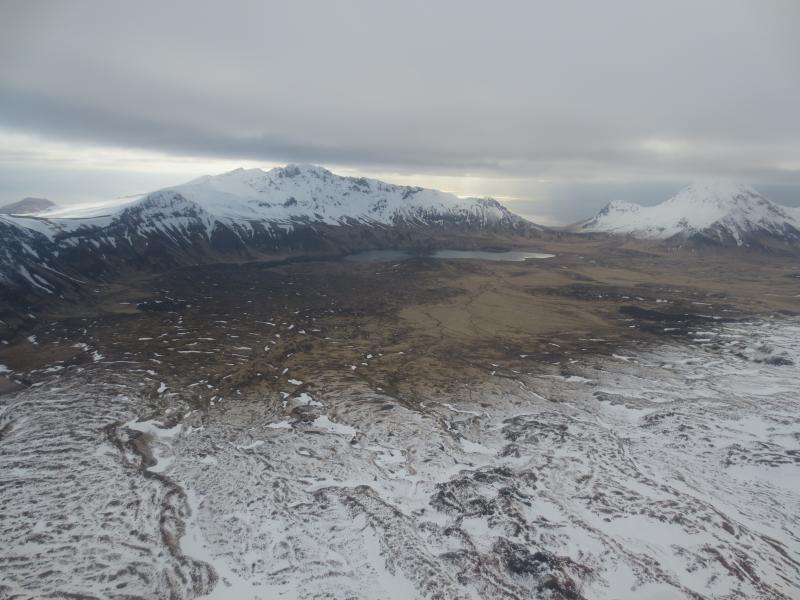 North half of the caldera as seen from the west.  Perret Ridge (l) and Ragged Top (r).   An old lava flow from Mt Cerberus can be seen flowing down toward Fenner Lake on the left side of the image.  Photos of Semisopochnoi Island taken in May 2017 during AVO station maintenance activities and supported by U.S. Coast Guard.  