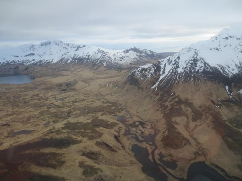 Looking to the NE along the east edge of the caldera.  Ragged Top on the right,  and Perret Ridge at top left.  Fenner Creek at lower right.  Photos of Semisopochnoi Island taken in May 2017 during AVO station maintenance activities and supported by U.S. Coast Guard.  