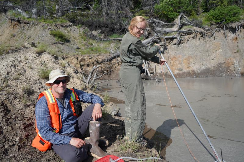 Tim Orr &amp; Valerie Wasser assist with gas sample collection at Shrub&#039;s summit pond.