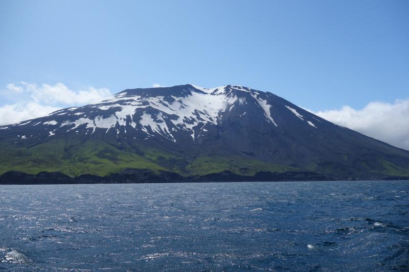Korovin volcano as viewed from the M/V Steadfast, off the NE shore of Atka island.  Note steam rising just above the south crater rim.
Station ID = 19AAJRS004