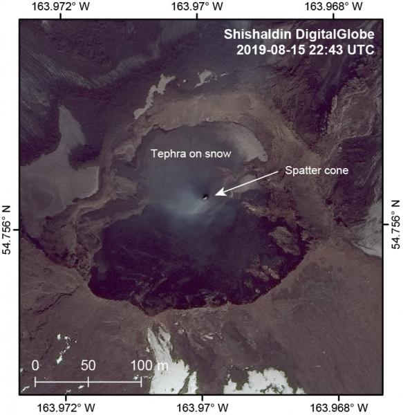The crater of Shishaldin is visible in this DigitalGlobe image from 2019-08-15. The spatter cone that has been building within the crater can be seen here with an incandescent top that also the source of a wispy plume. Above the spatter cone to the north, the snow has been largely buried underneath tephra from the strombolian activity. Shadows obscure the southern portion of the crater.