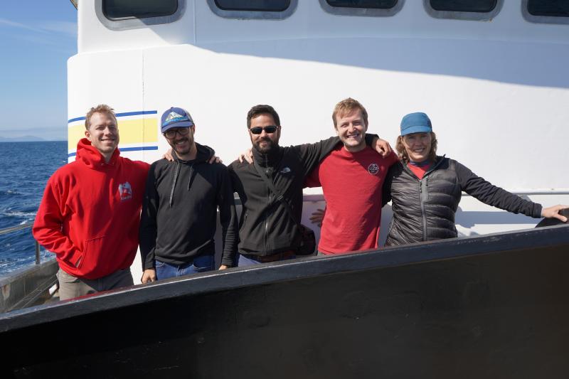 AVO scientists celebrate the beautiful weather while transiting to Korovin volcano: John Lyons, Peter Kelly, Ricky Garza-Giron, Liam Toney and Michelle Coombs.