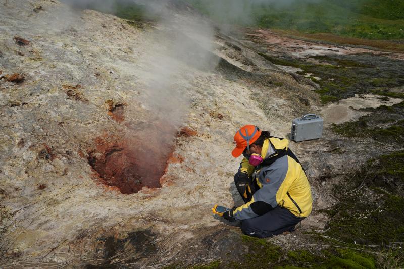 Peter Kelly (USGS) measures the temperature of a gas vent at Ole Steamy thermal area, west of Korovin volcano in the Atka Volcanic Cluster.