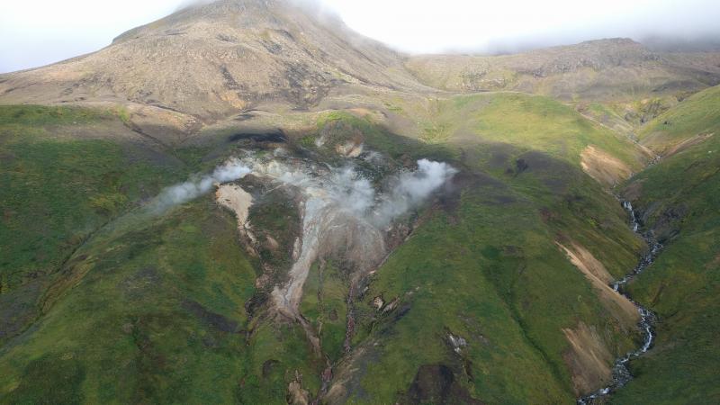 Steam emitting from fumaroles and bubbling pools in Akutan Volcano&#039;s upper Hot Springs Valley.
