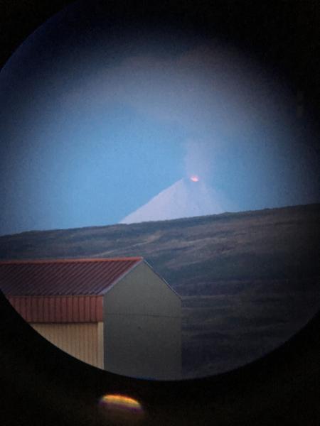 Shishaldin summit on October 21, 2019 from Cold Bay. Strombolian activity with incandescence is visible within the crater, as well as a steam plume rising above. Courtesy of Ben Lagasse and Andrew Reeves.  
