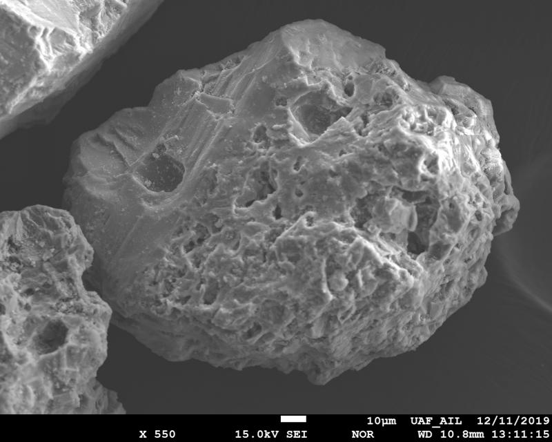 SEM image of ash particle from the June 27, 1992 eruption of Spurr Volcano. The sample was collected by Charles Elmore, a local Anchorage resident, immediately after the ashfall. The image was acquired using JEOL 8350f electron microprobe at the Advanced Instrumentation Laboratory, University of Alaska Fairbanks. 