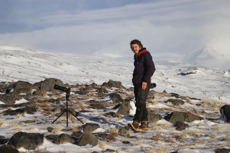 Field technician Wyatt Mayo (AVO/DGGS) sets up his camera on the south flank of Shishaldin volcano to capture images of ash emission from the summit.