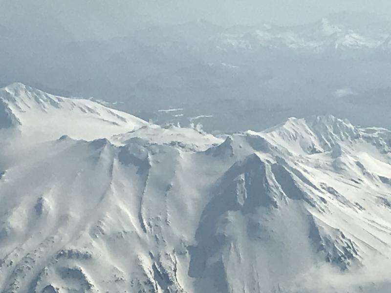 Views of Great Sitkin volcano taken on an Alaska Airlines flight from Anchorage to Adak, Alaska on March 21, 2020. Snow free ground due and light steaming observed. 