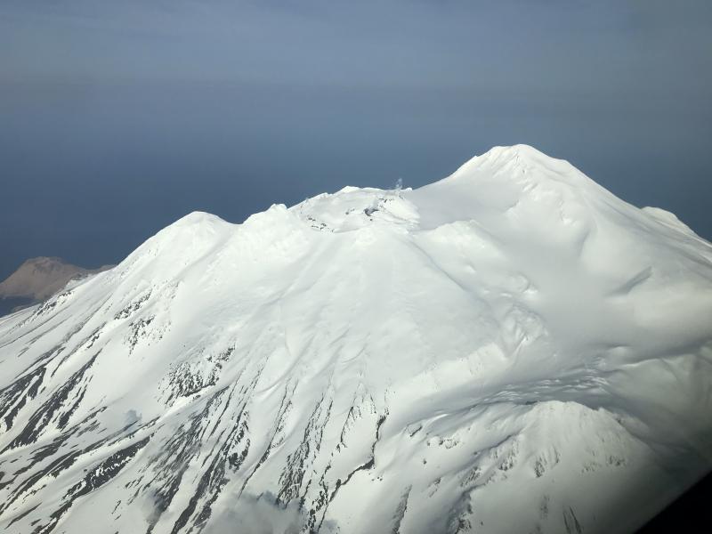 Views of Great Sitkin volcano taken on an Alaska Airlines flight from Anchorage to Adak, Alaska on March 21, 2020. Snow free ground due and light steaming observed. 