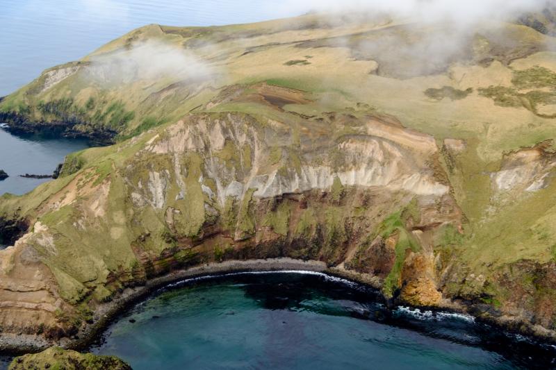 Lava, debris, and pyroclastic flows along with airfall tephra deposits on NE Davidof Island.