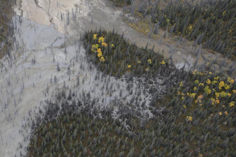 Oblique aerial view of Shrub mud volcano in the Copper River basin west of Mt. Drum, in the Wrangell Mountains near Glennallen, AK. The light gray is from an ongoing mud release from the north flank of Shrub that began in 2019.