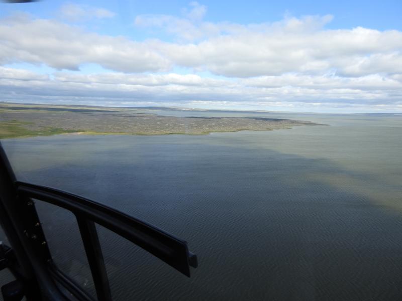 Oblique aerial view of the lava delta formed when a branch of the Lost Jim lava flow entered Imuruk Lake. The delta has an area of about 3 square km (~1 square mile).