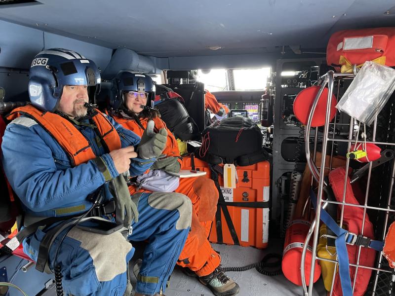 Marty Becker (USFS) and Cheryl Cameron (AVO-ADGGS) aboard USCG helicopter en route to overflight of Edgecumbe volcano. 