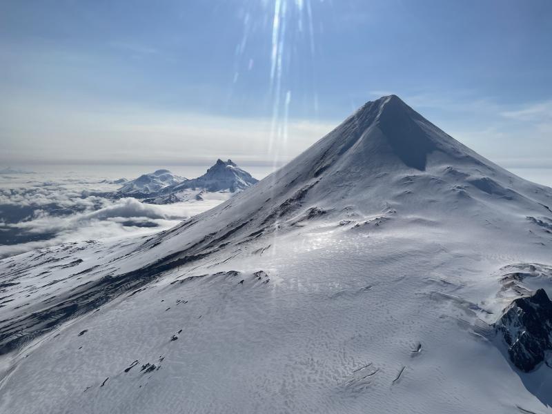 Northwest flank of Shishaldin Volcano, with Isanotski and Roundtop volcanoes in the background. View is from the northwest. Photo taken during the 2021 Steadfast campaign