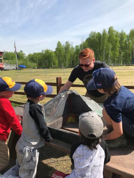 David Harvey (UAF/DGGS) talks with cub scouts about volcanoes in Fairbanks at a science themed day camp. 06/01/22