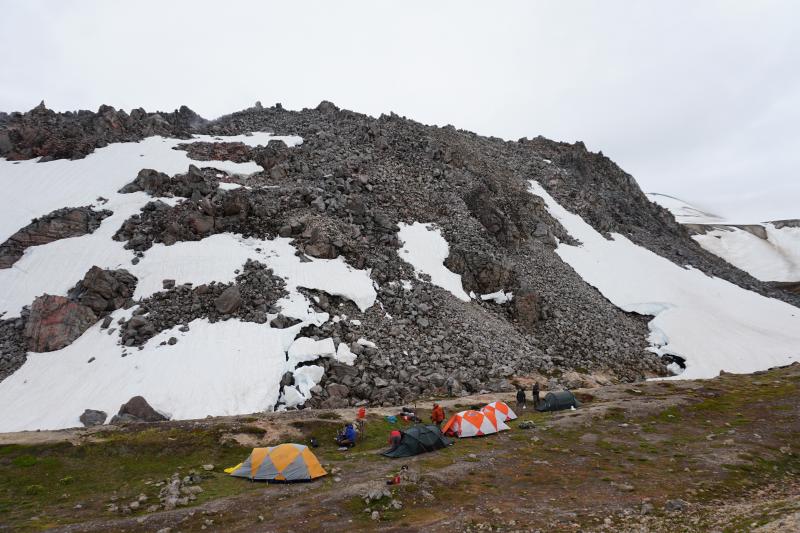 Campsite of the 2022 International Volcanological Field School hosted by the University of Alaska Fairbanks, with Novarupta Dome in the background.