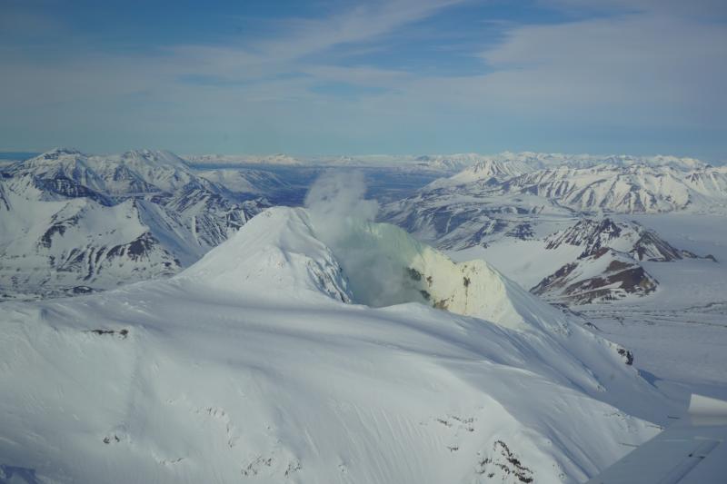 Aerial view of a degassing plume lofting above the crater rim from Martin's fumarole field.