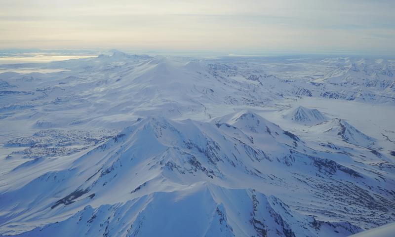 Aerial view of Trident volcano from the northeast, with Mageik seen in the background.