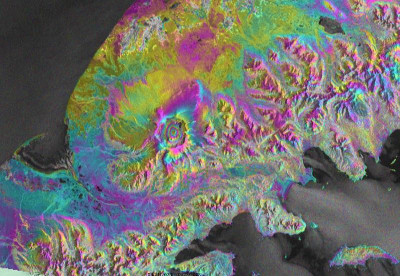 Sentinel-1 satellite radar interferogram spanning March 11&ndash;23, 2023, Aniakchak volcano. The bullseye pattern of color bands, or fringes, in the center of Aniakchak&#039;s caldera are indicative of surface uplift that is consistent with magma intrusion at around 4 km depth. Figure by Ronni Grapenthin, UAFGI/AVO.