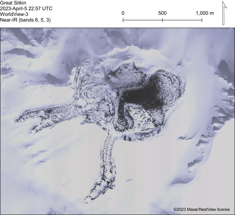 WorldView-3 near-IR satellite image of Great Sitkin and the 2021&ndash;2023 lava flow field. The current lava flow is advancing to the east into the summit crater ice-field with the active flow visible as dark, snow-free lava. 