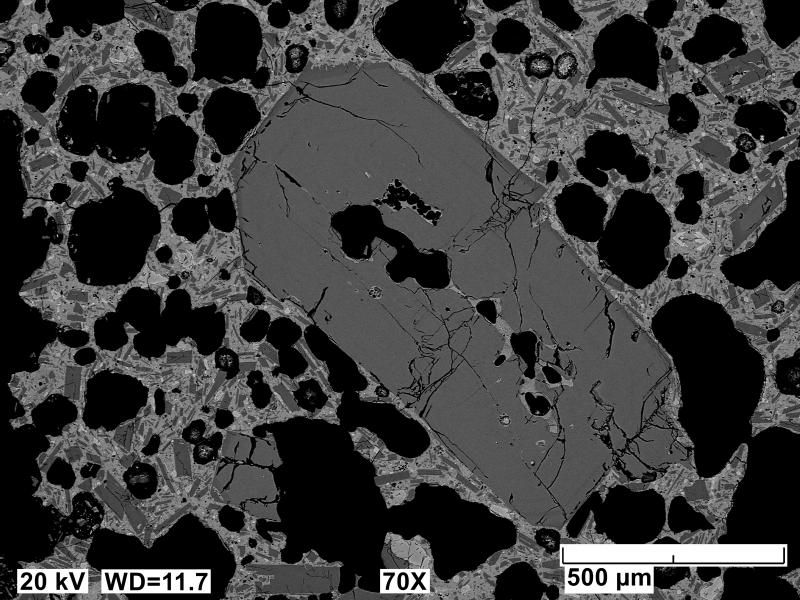 Backscatter electron polished mount image of an Edgecumbe basalt scoria clast (sample 81ARJ073A). A rare ~1 mm-long plagioclase phenocryst is visible in this image. Image acquired on an JEOL 6510LV SEM at 20 kV, 12 mm working distance, spot size of 65, and in BEC imaging mode.