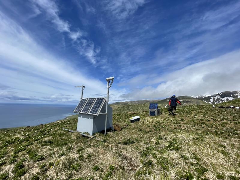 AVO field team installing a new webcam at site GSCK, Great Sitkin Volcano, Andreanof Island, western Aleutians.