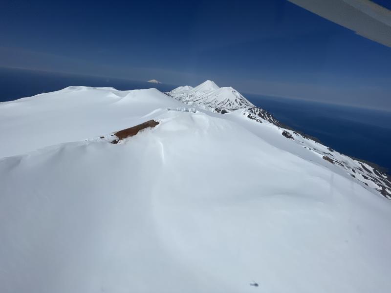 Snow-free ground at the summit of Takawangha volcano (this is on the south edge of crater #5 from the Coombs et al., 2003 report). Tanaga and Sajaka Volcanoes are visible behind Takawangha, and Gareloi Volcano in the distance. 