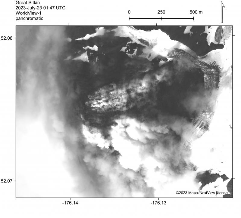 Panchromatic WorldView-1 satellite image of the active lava flows in the summit crater of Great Sitkin Volcano from July 23, 2023. Lava is flowing from a vent near the steaming area in the center of the photo to the east into ice that fills the summit crater.