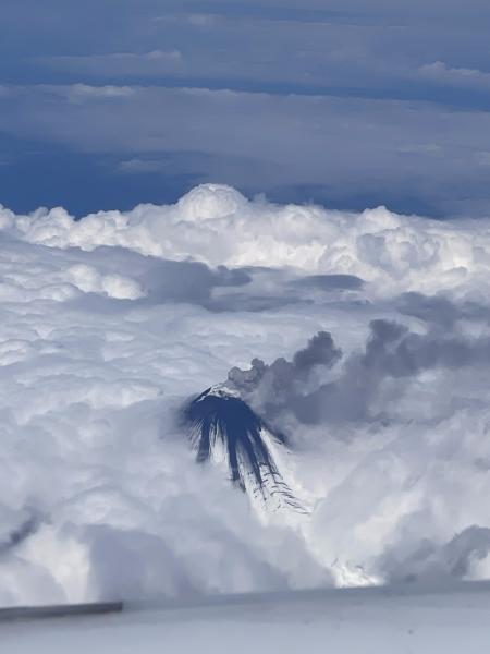 Photo of low-level ash emissions from Shishaldin Volcano taken on August, 15, 2023 at 14:26 AKDT from a position south of the volcano. 