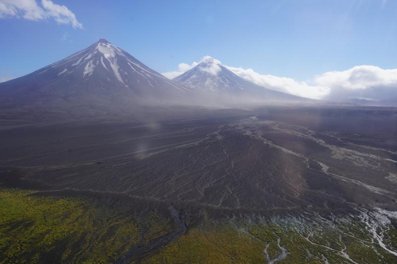 Resuspended ash on the north flanks of Pavlof Sister (left) and Pavlof Volcano (center).