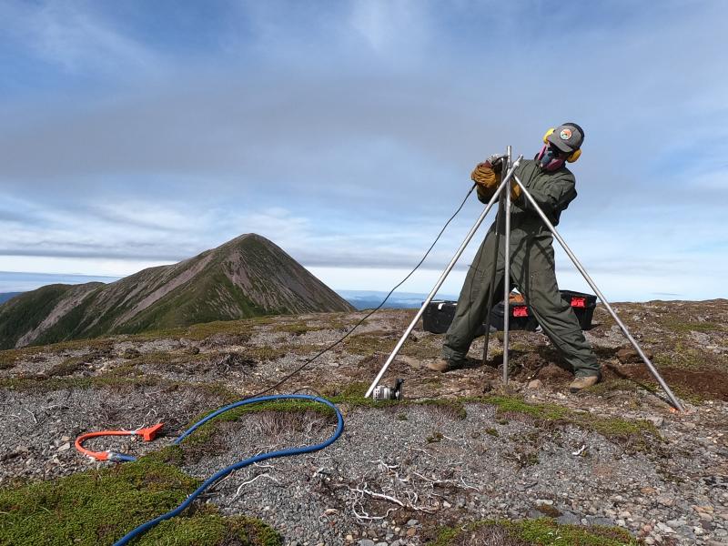Installation of AVO&#039;s new seismic and GNSS network at Mt. Edgecumbe volcano, August 20-29 2023.   AVO field technician Max Kaufman constructs GNSS antenna monument at site EDCR on Crater Ridge. 12 ft long by 1&quot; stainless steel rods are driven 7 ft into the ground, then trimmed and welded together at the top.