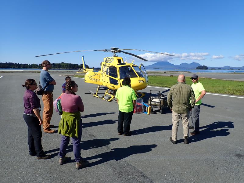 AVO field team and their escort greet the pilot from Coastal Helicopters on the first day of the project, August 2023, Sitka Alaska.