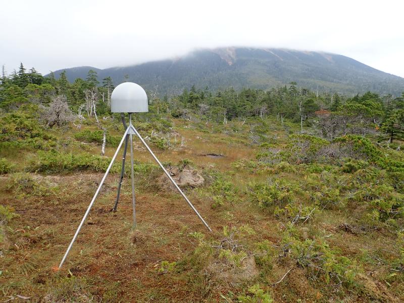 Installation of AVO&#039;s new seismic and GNSS network at Mt. Edgecumbe volcano, August 20-29 2023.  GNSS antenna monument at site EDSO made of 12 ft by 1&quot; stainless steel rods driven 7 ft into the muskeg, and welded together at the top.